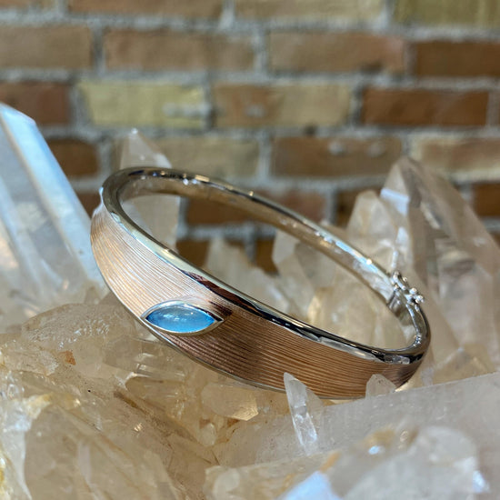 two-tone-bangle-with-blue-topaz-accent
