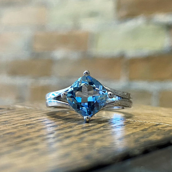 double-v-ring-with-blue-topaz