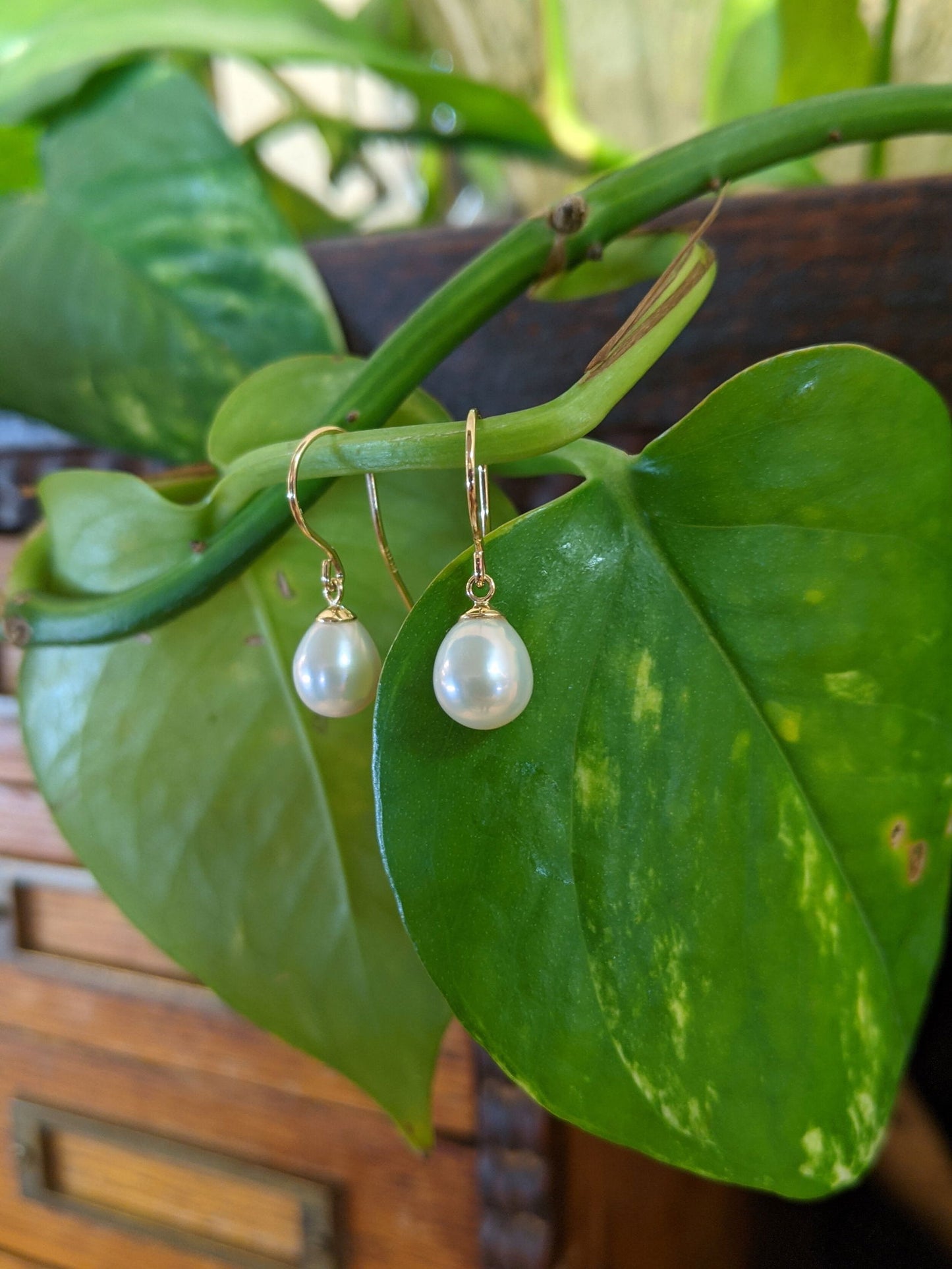 Photo of Fresh Water Pearl Drops in a decorative scene, designed by , available at Plumb Gold & Plumb Silver