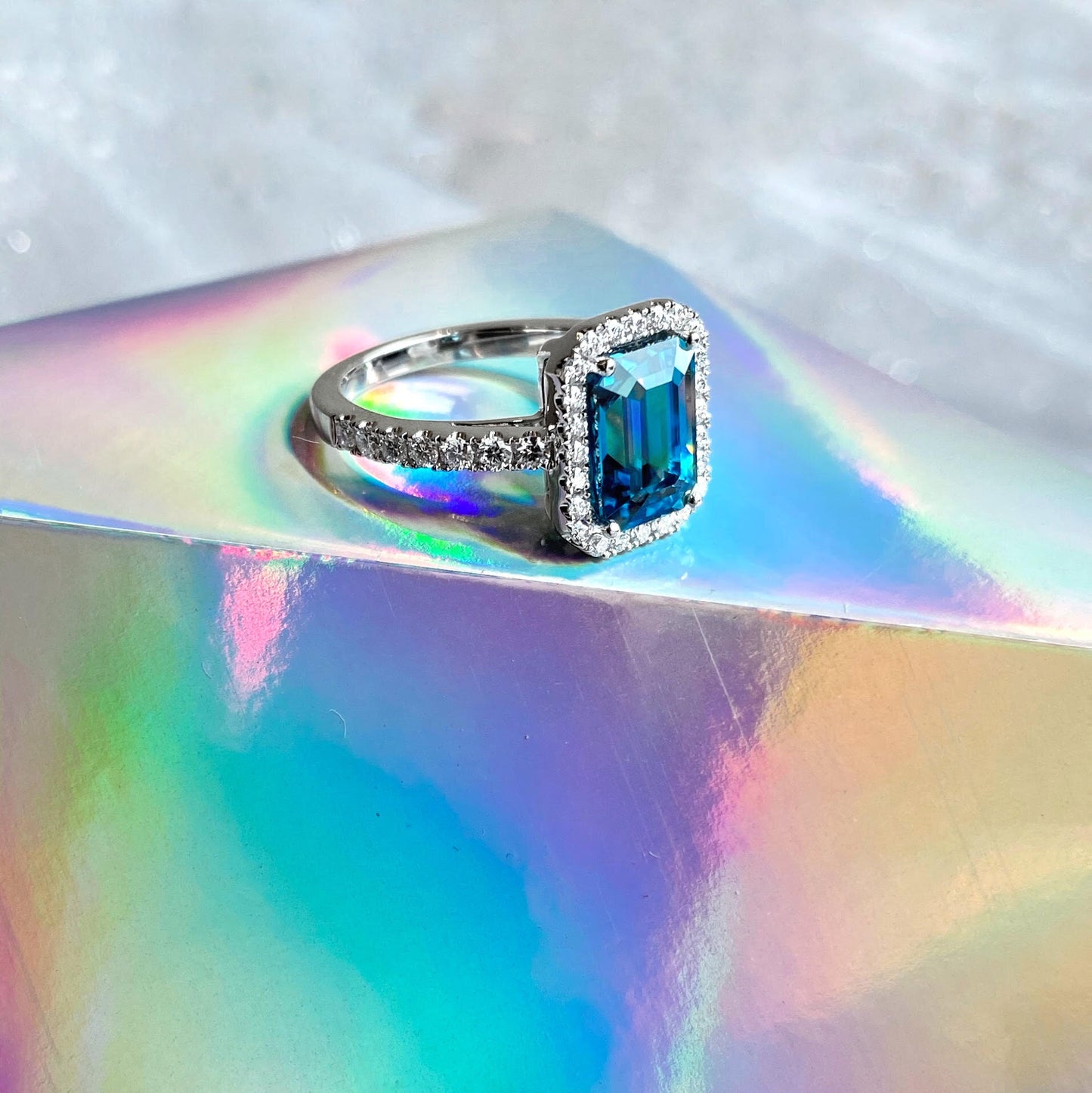 Zoma Color Emerald Cut Blue Zircon Ring with Diamond Halo